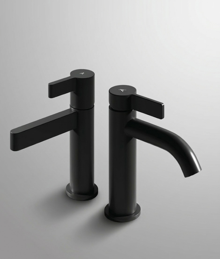 Artize Aris and Aura faucets arranged overhead on marble — Designer's Touch